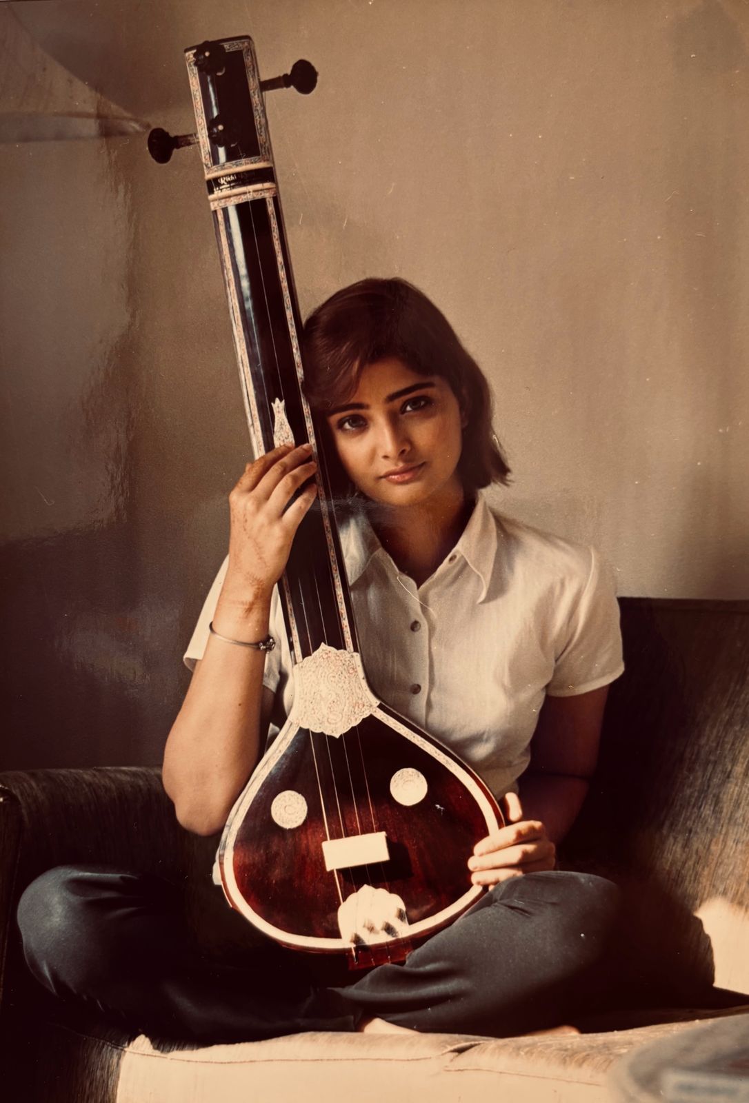 Vasundhara Das as a young musician with a tanpura.